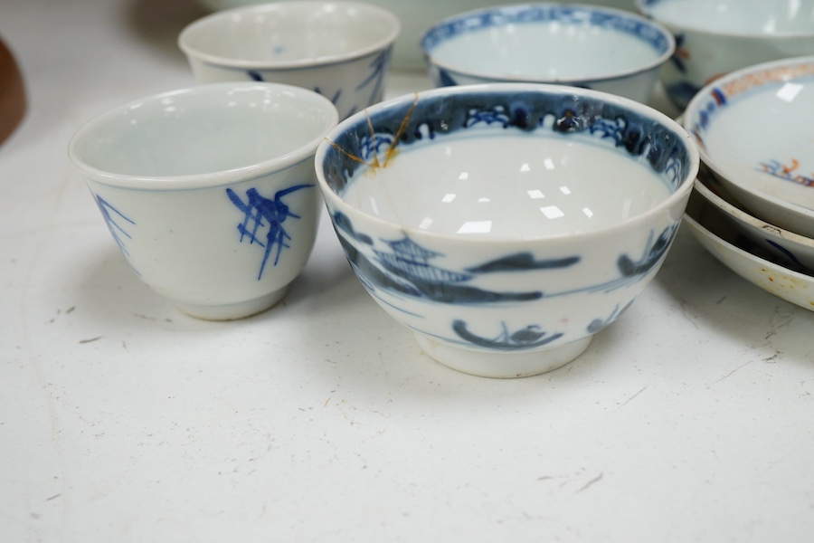 A collection of 18th century and later Chinese porcelain to include tea bowls and saucers and a large dish (a.f), largest 33cm in diameter